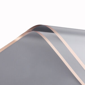 FOL-VE-30-07 Aranycsíkos íves fólia csomagoló - 20 ív/csomag 58cm x 58cm áttetsző/rose gold